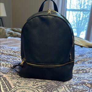 Navy Backpack with Gold Accents and Textured Fabric